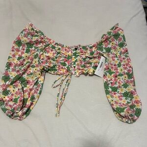 Front tie long-sleeve cropped top. Green, pink, and yellow florals